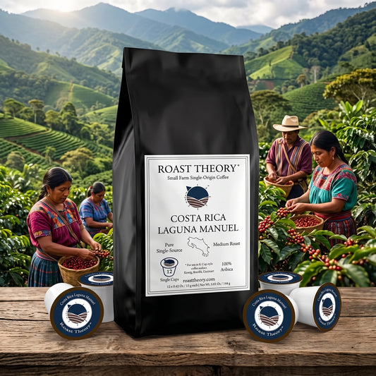 Costa Rica 100% Laguna Manuel Single-serve Coffee Pods by Roast Theory. A large black bag of Roast Theory Costa Rica Laguna Manuel coffee stands on a wooden surface in front of a lush green coffee plantation scene with workers harvesting cherries. Several small coffee cups are arranged around the bag.